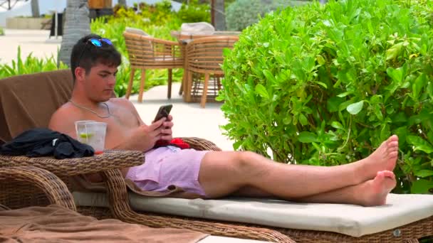 Young Adult Male Lounges Poolside Caribbean All Inclusive Resort Looking — Wideo stockowe