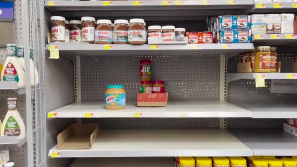 Half Empty Peanut Butter Section Walmart Everything Shortage 2022 — стоковое видео