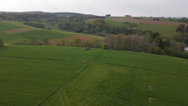 Downward Looking Drone Footage Large Green Meadows Tractor Driving — Stockvideo