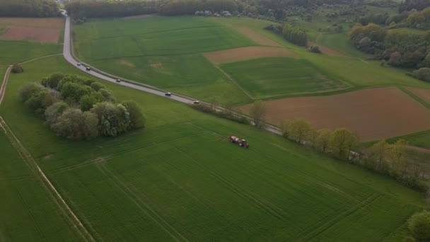 Wide View Drone Footage Tractor Spraying Large Green Pastures Next — Wideo stockowe
