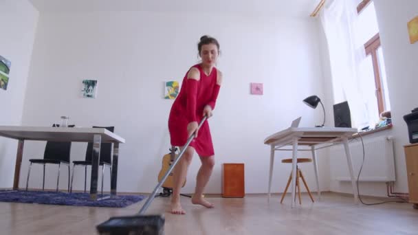 Girl Sweeping Floor Dancing Work Fun Interior Low Angle Slider — Stock videók