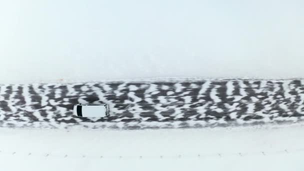 Aerial Top View Tracking Van Car Driving Moving Winter Snowy — Wideo stockowe