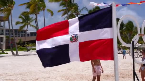 Dominican Republic Flag Waves Front Palm Trees Tropical Resort White — Stockvideo