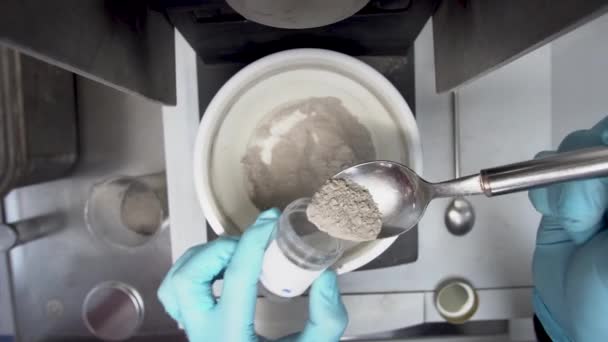 Lab Worker Scoops Powder Mill Container Testing Overhead — Stock video