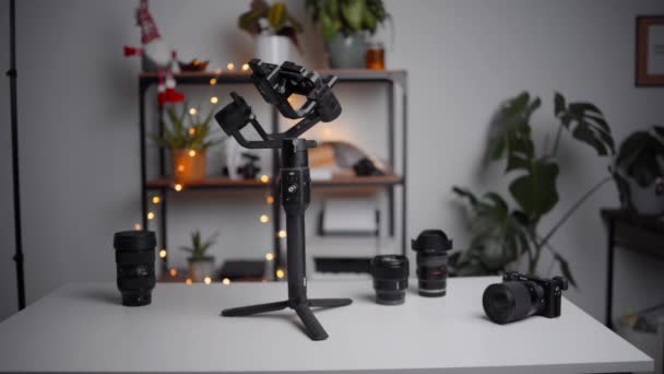 Video Gear Laid Table Showing Gimbal Camera Lenses — Vídeos de Stock