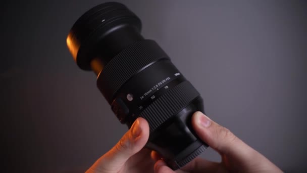 Zoom Lens Hold Hand Grey Background — Stock Video