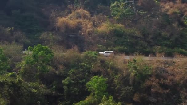 White Family Car Traveling Curvy Mountain Roads Vietnam Aerial Backwards — Video