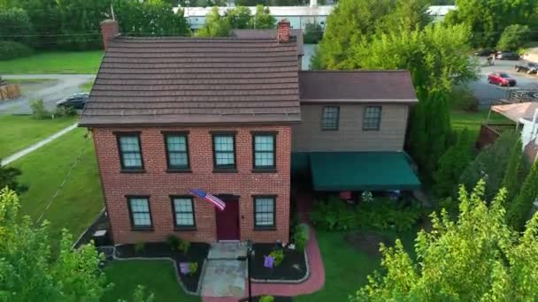 Rising Shot Old Brick Home Suburb American Flag Hanging Front — Video