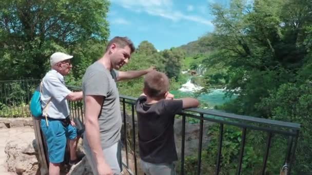 Father Son Grandfather Quality Time Pointing Scenic Waterfall — Vídeo de stock