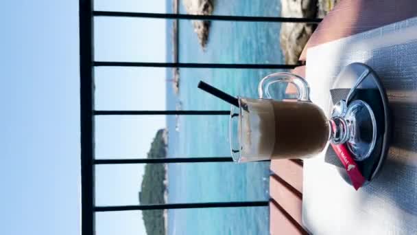 Cup Iced Latte View Blue Sea Rocky Coast Old Town — ストック動画