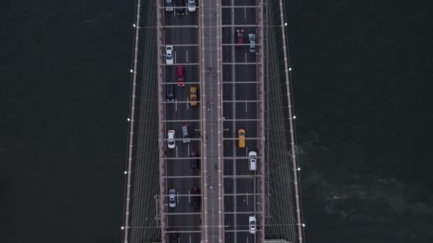 Aerial view on top of cars driving on the Brooklyn bridge, in New York, USA - birds eye, drone shot