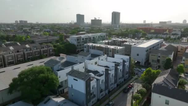 Residential Homes Urban City Setting Aerial Orbit Reveals Downtown Skyscrapers — Stock Video