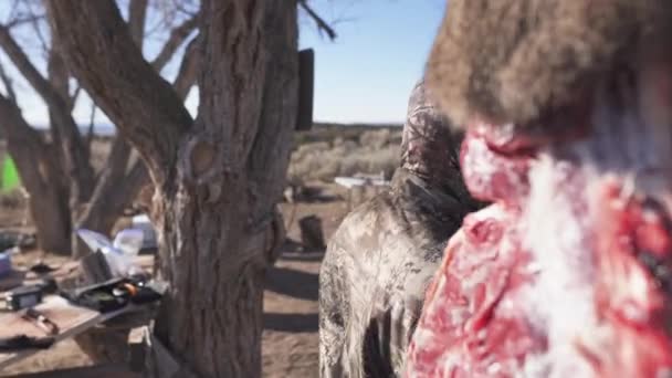 Hunter Dressed Camo Cuts Piece Raw Meat Deer Hangs Tree — Stock videók