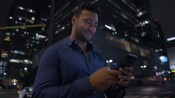 Happy Smiling Office Worker Man Using Smartphone Standing Seoul Downtown — Stock video