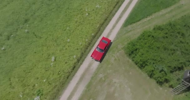 Dynamic Cinema Drone Shoot Follows Red Construction Year Buick Riviera — Stockvideo