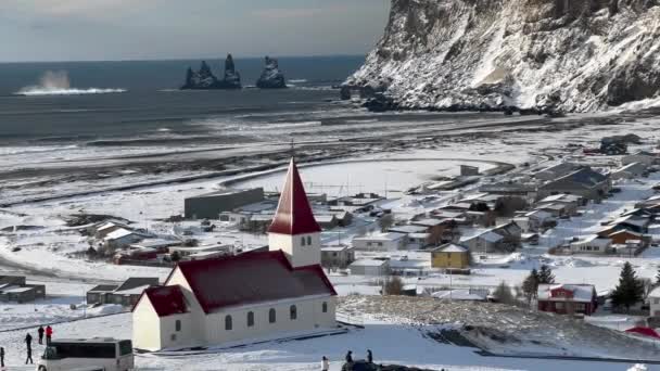 Aerial View Showing Snowy Sunny Day Vik Church Foreground Basalt — Vídeos de Stock