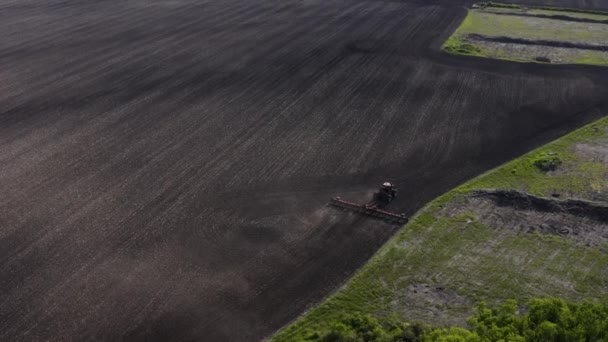 Aerial Shot Tractor Cultivating Large Unplanted Field Agricultural Machines Working — Wideo stockowe