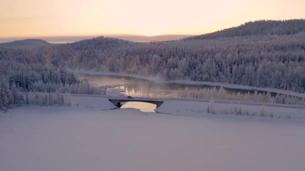 Aerial View Fast Car Car Driving Ice Lake Bridge Glowing — ストック動画