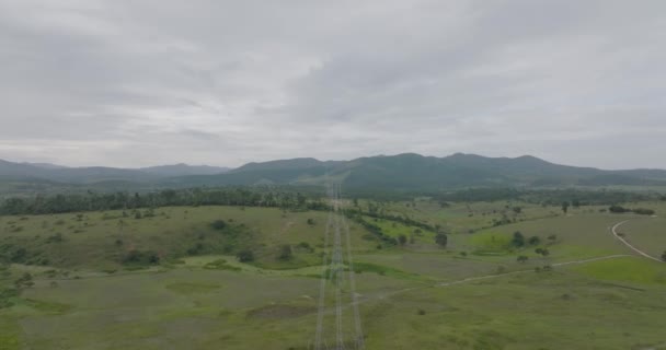 Aerial Flying High Voltage Cables Towers Countryside Cloudy Day — Stockvideo