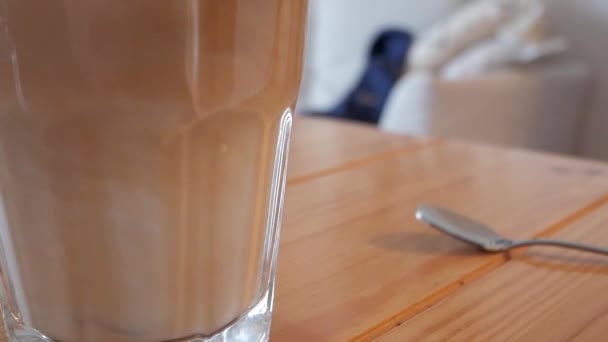 Close Trasnparent Tall Glass Latte Coffee Wooden Table Tea Spoon — Video