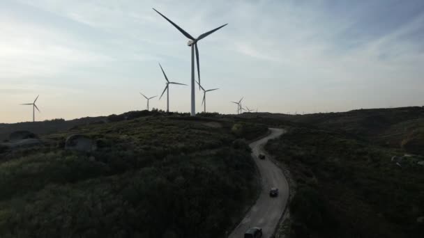 Drone Follow Three Jeep Traveler Driving Windmill Road Mountain Landscape — 图库视频影像