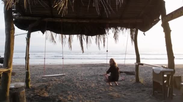 Young Blonde Woman Enjoying Beautiful Sunset While Sitting Swing Set — Stock Video