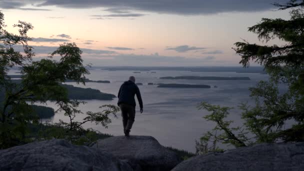 Male Hiker Walking Sitting Nordic Mountain Cliff Looking Horizon Enjoying — Video