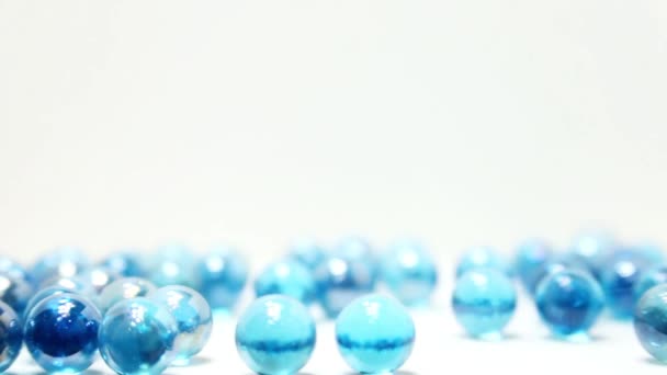 Reverse Slow Motion Blue Marbles Bouncing Tumbling Out Frame Moving — Stock video