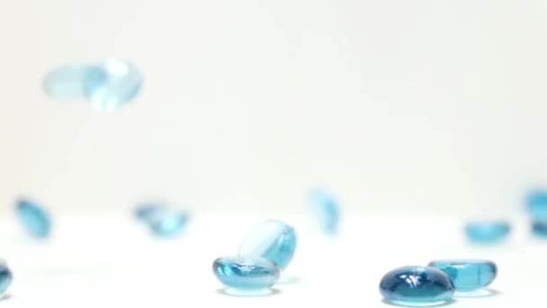 Forward Slow Motion Blue Glass Disks Bouncing Tumbling Frame — Vídeo de stock