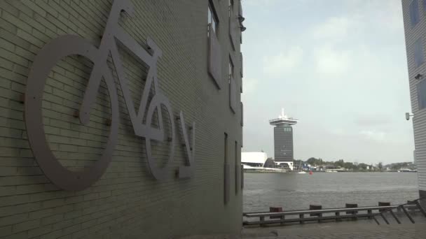 Shot Amsterdam Tower Dock Big Bicycle Sign Front Typical Dutch — Stok video