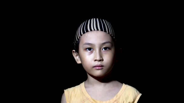 Muslim Southeast Asian Boy Looks Longingly Camera Alone Black Room — Αρχείο Βίντεο