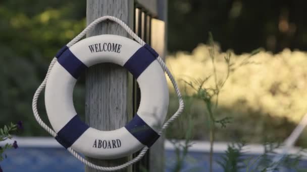 Lifebuoy Labeled Welcome Perched Pool — Vídeos de Stock