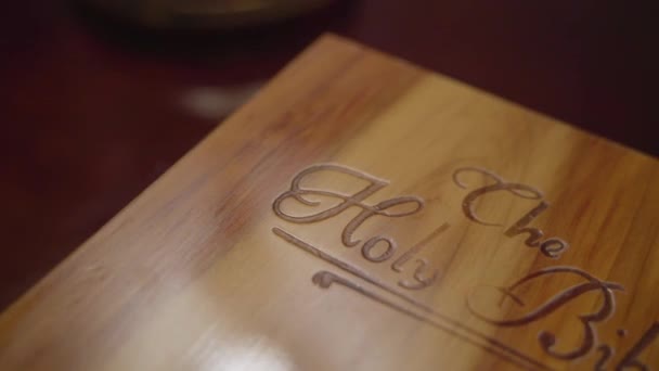 Close Wooden Book Box Labeled Holy Bible — Stockvideo
