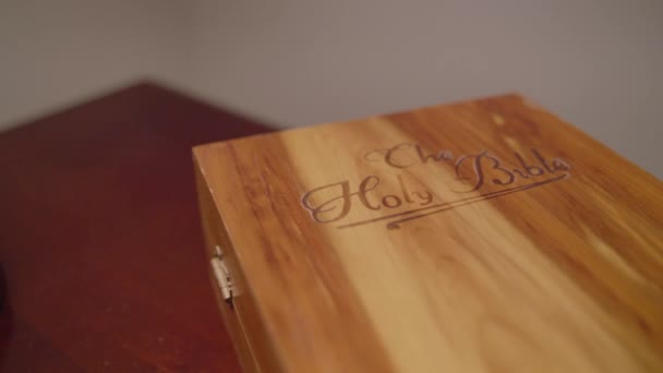 Wrap Wooden Book Box Labeled Holy Bible Side Table — Vídeo de Stock