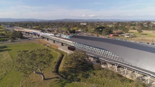 Aerial Shot Panning Skatepark Train Station Train Line Running Overhead — Stok video