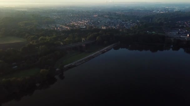 Descending Aerial Forward Moving Lake Reservoir Rail Bridge Sunrise Frosty — стокове відео