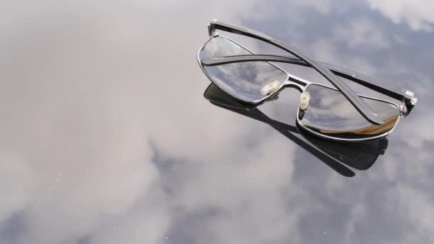 Time Lapse Video Reflected Clouds Table Sunglasses Malta — Stock Video