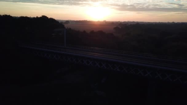 Rising Aerial Drone Footage Train Bridge Horizon Sunset — Stok Video