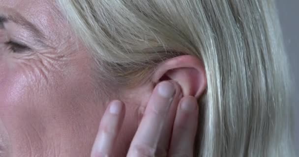 Woman Suffering Tinnitus Rubbing Ringing Ear — Stockvideo