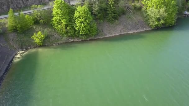 Aerial Panning Reservoir Structure Trees Water Front — Stockvideo