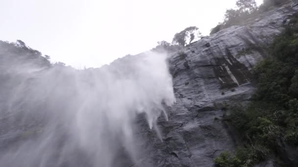 Slow Motion Shot Waterfall Crashing Cliff Face Being Blown Away — Video Stock