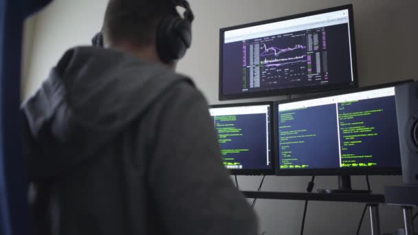 Hacker Three Computer Screens Typing Away — Stock Video