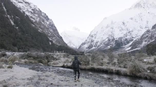 Slow Motion Shot Girl Hiking Gear Photographing Snow Capped Mountains — Stok video