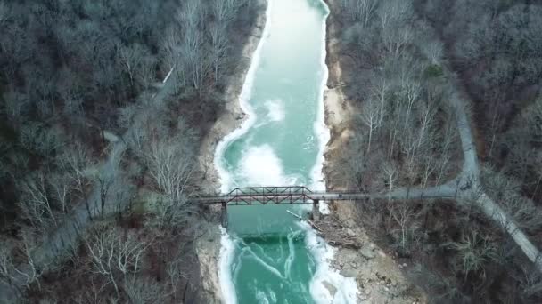 Rusty Footbridge Icy Mountain River — Stockvideo