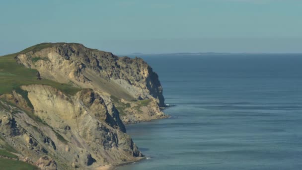 Steep Cliff Landslides Have Fallen Sea Calm Blue Ocean Surface — Stock Video