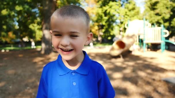 Boy Laughs Throws Arms Air Slow Motion — Vídeo de stock