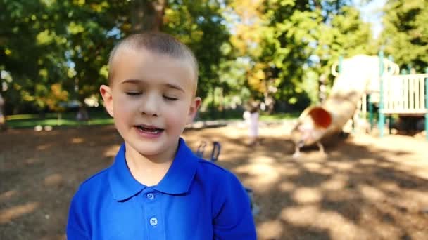 Little Boy Playground Nods His Head Yes Shakes His Head — Stock Video