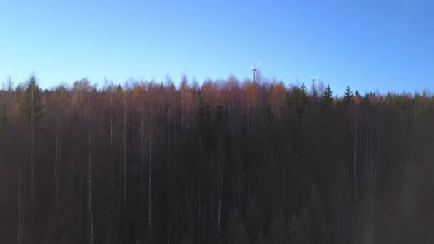 Aerial Rising Drone View Leafless Trees Hill Revealing Wind Power — Stockvideo