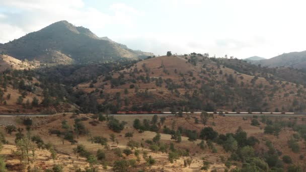 Aerial View Cargo Train Driving Sierra Nevada Mountains California — Stock video
