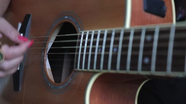 Woman Strumming Metal String Acoustic Guitar Close — Stockvideo